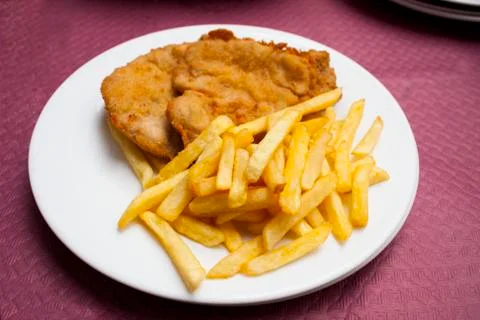 Escalope steak with potatoes Stock Photos