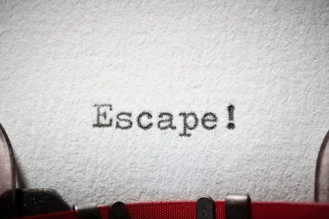Escape exclamation text written with a typewriter. Stock Photos