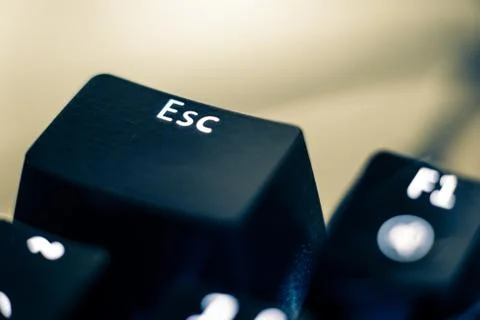 Escape Key Close-up on Backlit Keyboard. Stock Photos
