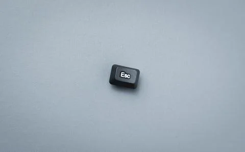 Escape Key Concept On Minimal Gray Background With Copy Space Stock Photos