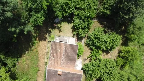 Escape to Nature: Aerial Pull Away from an Isolated Off-Grid House Stock Footage 329804610