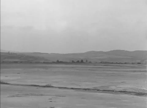 ESCHWEGE, GERMANY - 1947: Displaced persons — Skeletal hangar above empty apron Vidéo 343320784