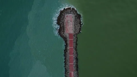 Escollera tip top down aerial view water boundary at Miramar beach sunrise Видео 346653569