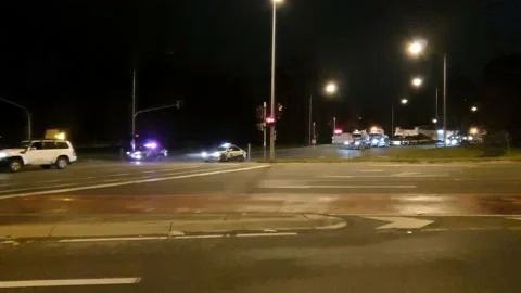 Escort Vehicles Secure Intersection for Transport Stock Footage 131720063