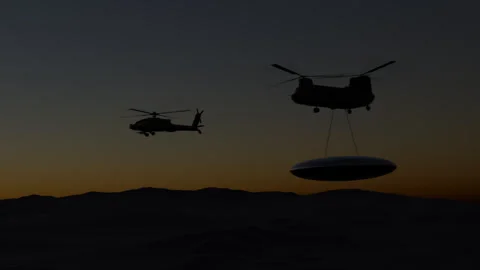 Escorted Chinook transporting UFO Stock Footage 247475999