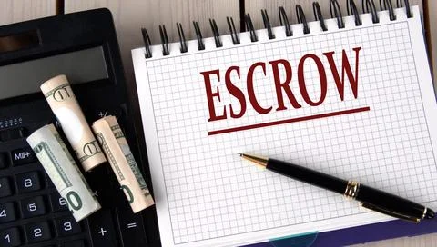 ESCROW - word in a notebook on the background of a calculator and banknotes Stock Photos