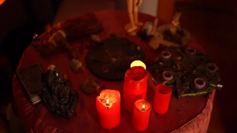 Esoteric ritual table with burning candles, mystical atmosphere, occult symbols Stock Footage 317223410