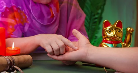 Esoteric salon, fortune teller predicts future by the hand, lines on the palm Stock Footage 258196642