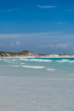 Esperance beach turquoise ocean waves washing white sand Stock Photos