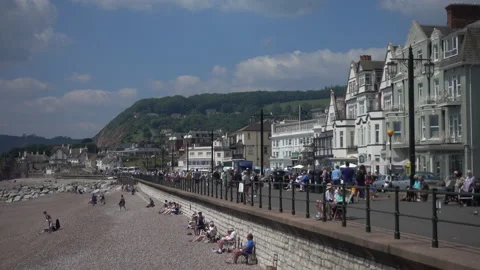 The Esplanade at Sidmouth in Devon.  Pebble beach and sunshine Video stock 156188095