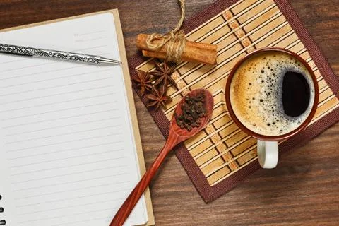 Espresso ans condiments and a notebook with pen Stock Photos