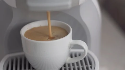 Espresso being made in capsule coffee machine Stock Footage 111138292