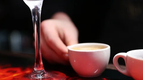 Espresso being poured into cocktail Stock Footage 102011384