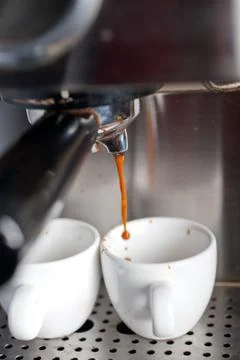 Espresso coffe making with professional machine Stock Photos