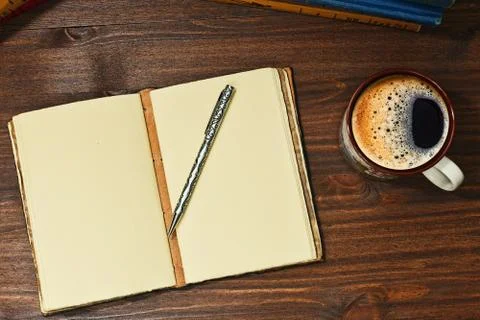 Espresso coffee and opened notepad Stock Photos