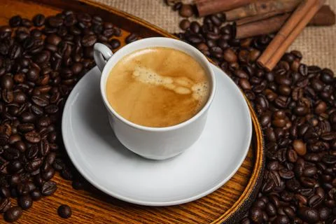 Espresso coffee on the background of coffee beans. Tonic drink.  Stock Photos