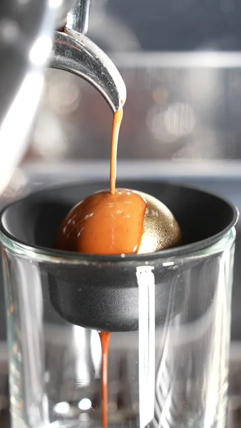 Espresso Coffee Brewing with Cold Paragon Sphere in Real Time Close Up Stock Footage 313543038