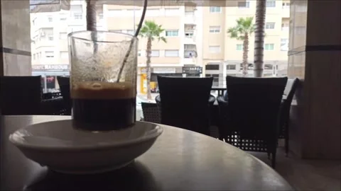 Espresso Coffee on Café Table with Sunny City Street Background Stock-Footage 334033225