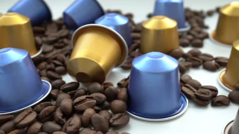 Espresso coffee capsules with beans in the background Stock Footage 132002674
