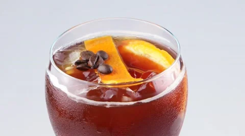 Espresso coffee cocktail with an orange Stock Footage 53572185