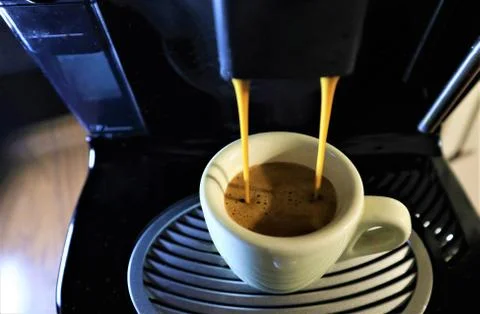 Espresso coffee from coffee machine Stock Photos