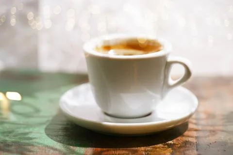 Espresso coffee cup on rustic table with sun Stock Photos