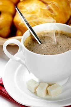 Espresso coffee in a cup with smoke on a white background Stock Photos