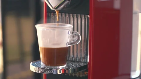 Espresso coffee drip from Nespresso machine - Slow Motion Stock Footage 66837433