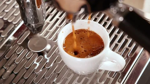 Espresso coffee dripping into a cup Video stock 188489371