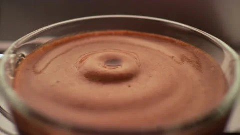 Espresso coffee drop into the filled Cup from the coffee machine in slow motion 스톡 동영상 167427385