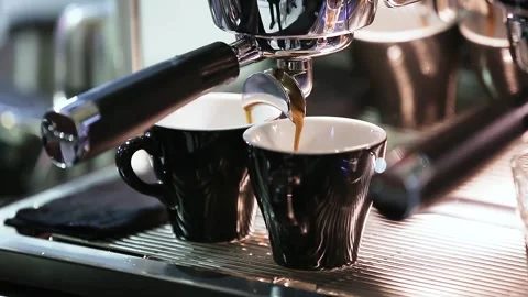 Espresso coffee extraction from a professional coffee machine Stock Footage 276159726