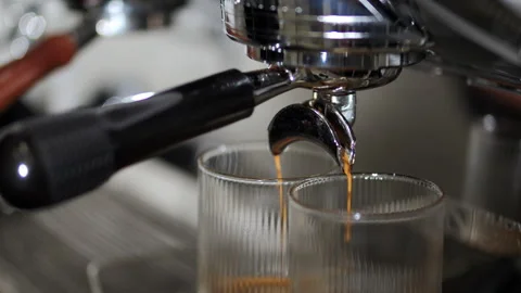 Espresso coffee extraction from professional coffee machine Stock Footage 326235317