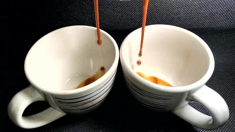 Espresso coffee falling into a cup Stock Footage 156758384