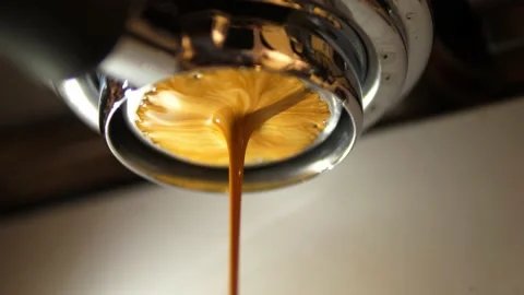 Espresso coffee from machine close up Stock Footage 166820633
