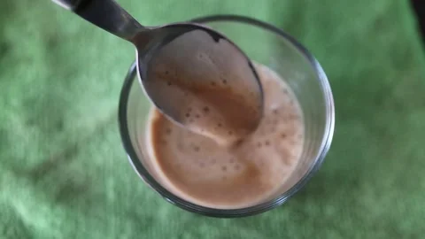 Espresso coffee mixed in the cup Stock Footage 308695188