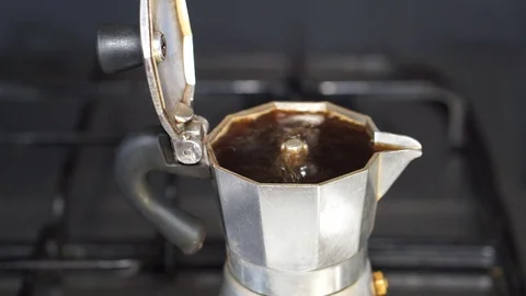 Espresso coffee in a moka coffee maker Stock Footage 104719281