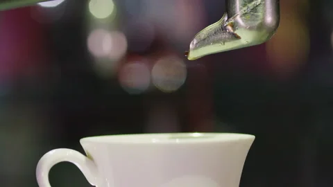 Espresso coffee poured in cup in slow motion 2 Stock Footage 130574919