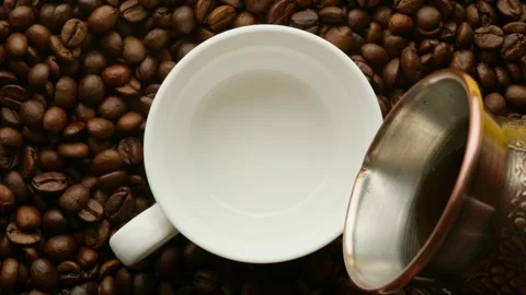 Espresso coffee is poured into a white coffee cup  Stock Footage 271168667