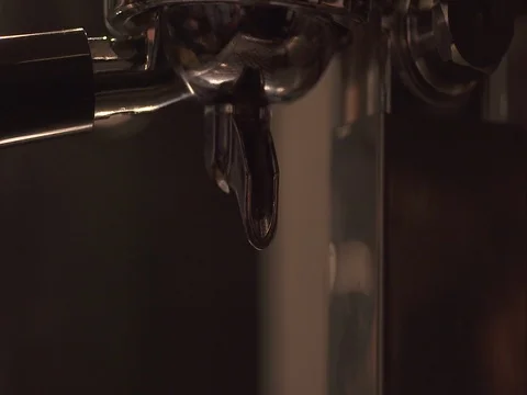 Espresso coffee pouring through the bottomless portafilter Stock Footage 73683602