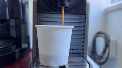 Espresso coffee stream from machine. Home making hot Espresso Stock Footage 232212041