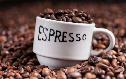 Espresso cup with coffee beans Stock Photos