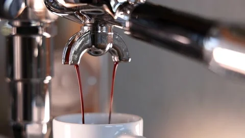Espresso dripping out of a professional machine Stock Footage 188489546
