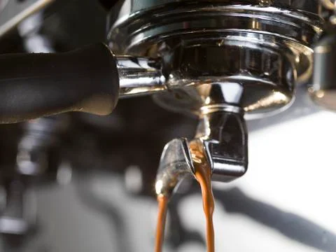 Espresso extraction with a proffessional coffee machine Stock Photos