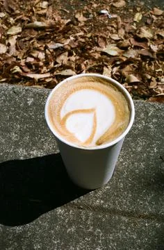 Espresso Latte on Sidewalk in Fall Stock Photos