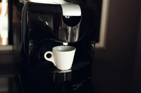 An espresso machine and a cup Foto stock