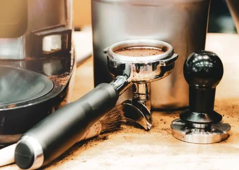Espresso machine brewing a coffee. Coffee pouring into glasses in coffee shop Stock Photos
