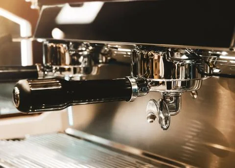Espresso machine brewing a coffee. Coffee pouring into glasses in coffee sh.. Stock Photos