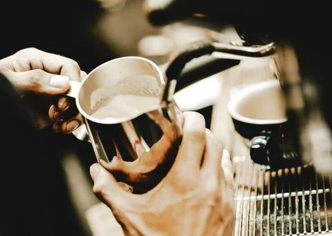 Espresso machine brewing a coffee. Coffee pouring into glasses in coffee sh.. Stock Photos