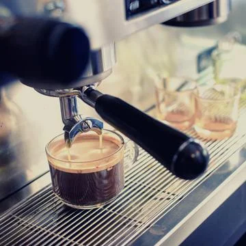 Espresso machine brewing a coffee Stock Photos