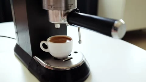 Espresso machine brewing a fresh cup of coffee in a white ceramic mug Video stock 339000575